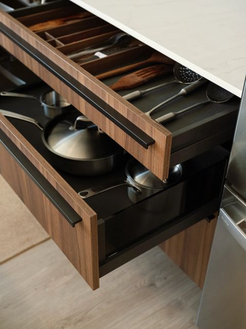 Greenville kitchen island with open walnut drawers featuring built-in cutlery organizer, utensil drawer, and deep pot storage with black pulls by Tekton Builds.